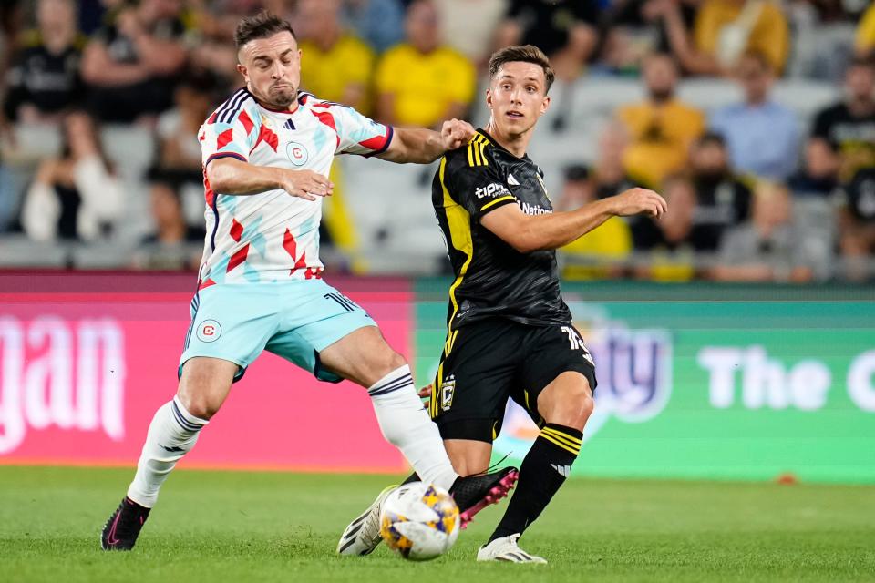 Sep 20, 2023; Columbus, Ohio, USA; Columbus Crew defender Malte Amundsen (18) kicks the ball past Chicago Fire midfielder Xherdan Shaqiri (10) during the first half of the MLS soccer game at Lower.com Field.