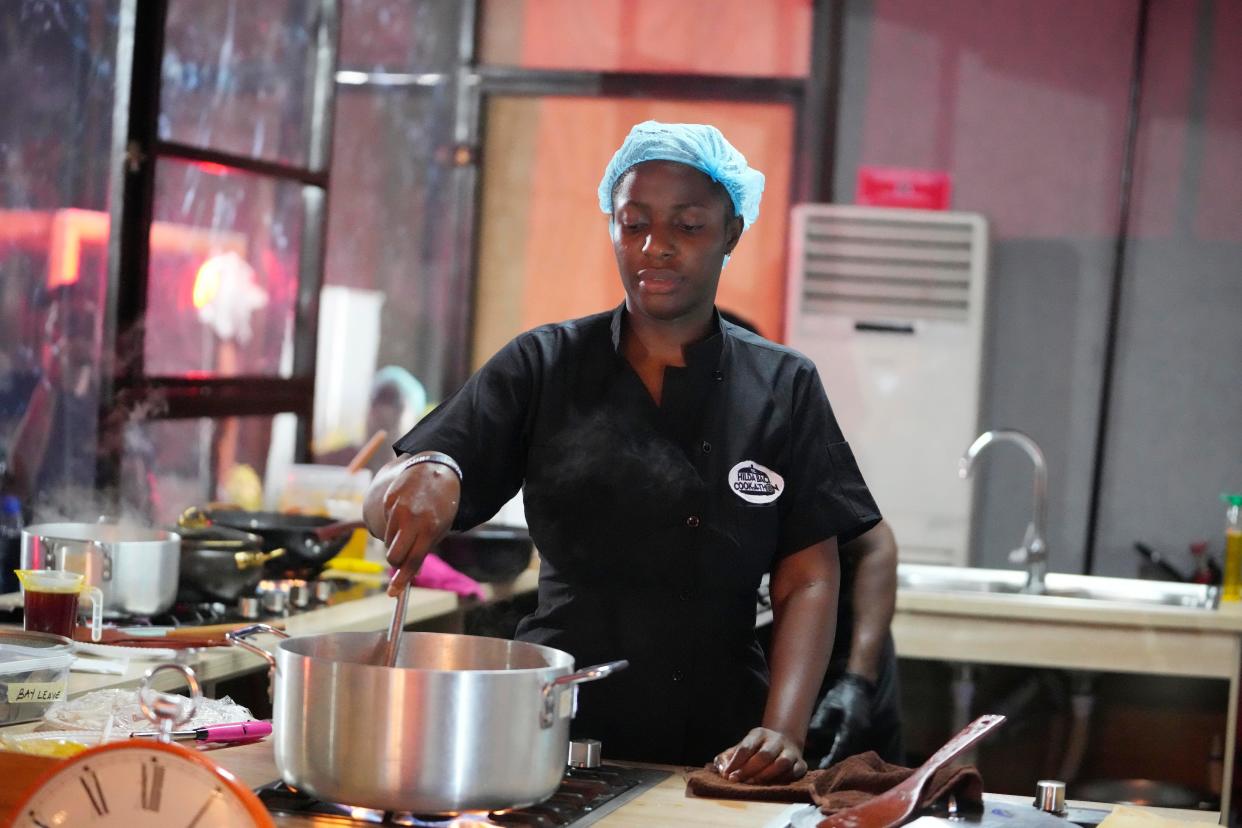 Chef Hilda Bassey Effiong cooking during her 100 hour world record session