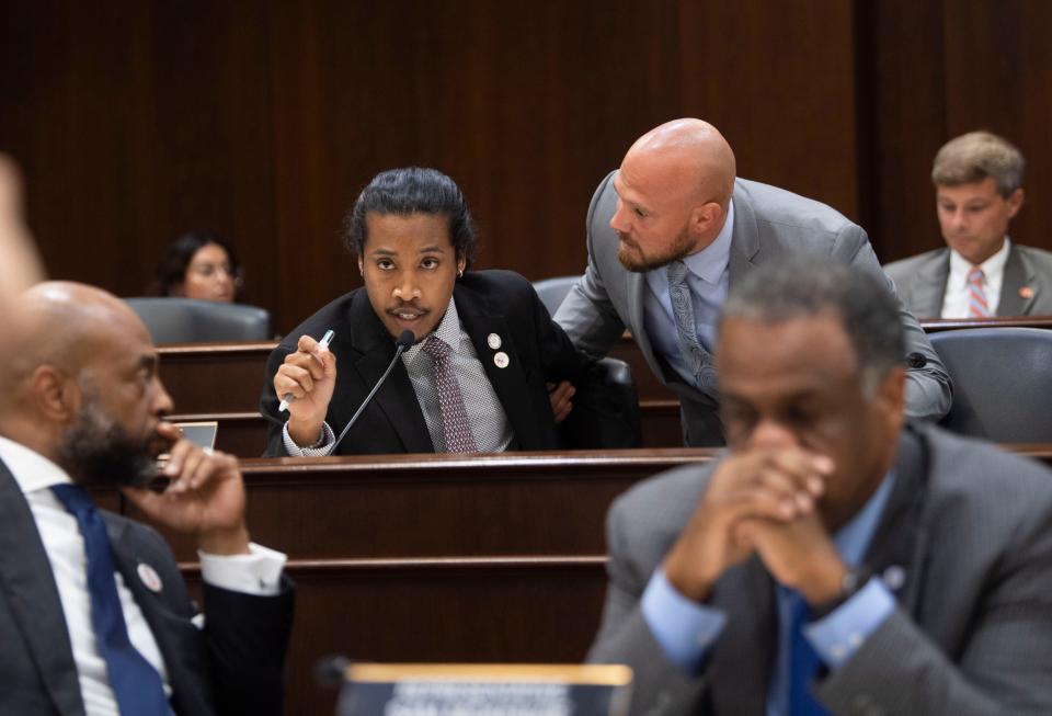 A Sergeant at Arms asks Rep. Justin Jones, D-Nashville, to stop speaking out of turn in the House hearing room during a heated exchange between representatives at a committee meeting at Cordell Hull State Office Building in Nashville, Tenn., on Wednesday, Aug. 23, 2023.