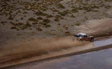 Dakar Rally - 2017 Paraguay-Bolivia-Argentina Dakar rally - 39th Dakar Edition - Fifth stage from Tupiza to Oruro, Bolivia 06/01/17. Sebastien Loeb of France drives his Peugeot with his copilot Daniel Elena. REUTERS/Ricardo Moraes