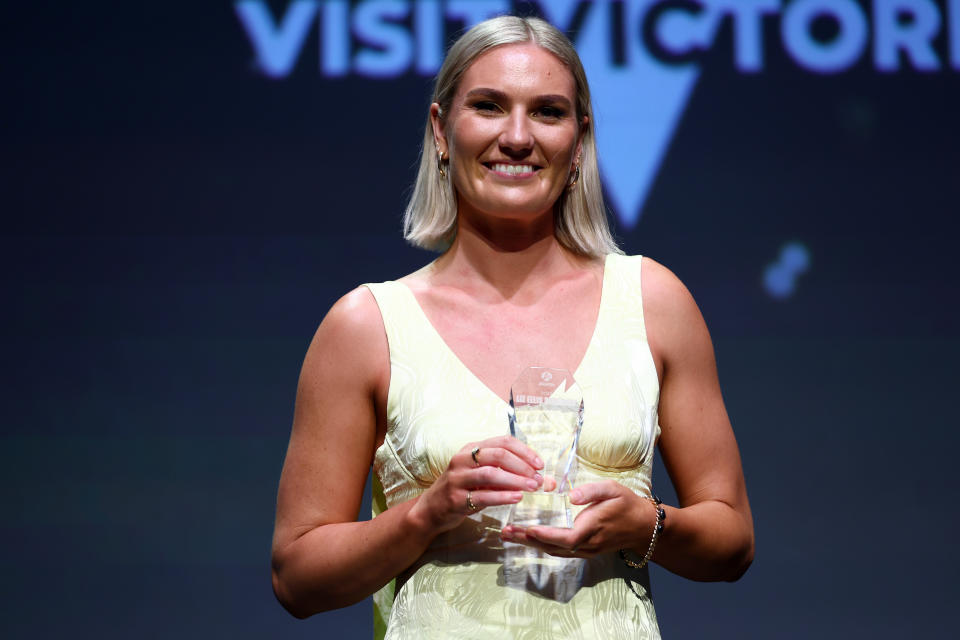 Courtney Bruce poses with the award.