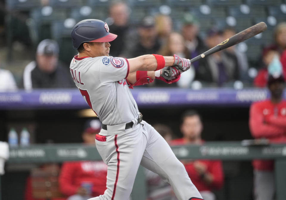 Washington Nationals' Alex Call watches his solo home run off Colorado Rockies starting pitcher Jose Urena during the first inning of a baseball game Friday, April 7, 2023, in Denver. (AP Photo/David Zalubowski)