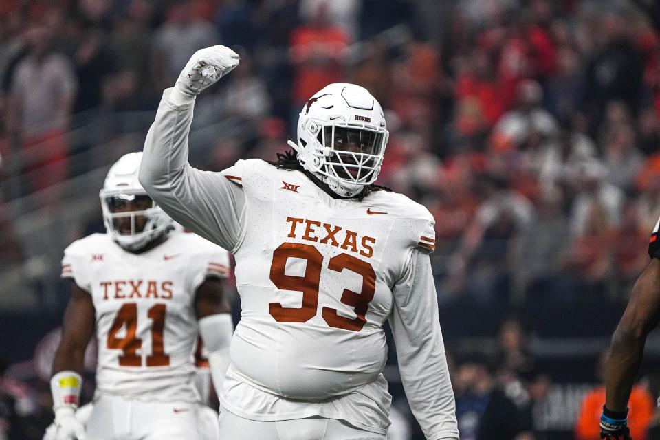 Texas Longhorns defensive lineman T'Vondre Sweat (93) celebrates a defensive stop during the Big 12 Championship game against the Oklahoma State Cowboys at AT&T stadium on Saturday, Dec. 2, 2023 in Arlington.