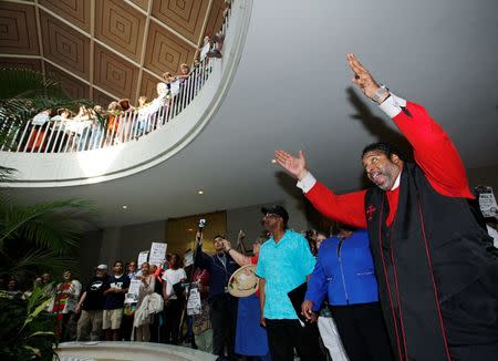 Reverend Doctor William Barber II, president of the NAACP's North Carolina chapter and leader of the "Moral Monday" civil rights protests, speaks against the state's HB2 "bathroom law" that restricts members of the LGBT community from using the bathroom of their choice, during a demonstration inside the rotunda of the state legislature in Raleigh, North Carolina on May 16, 2016. REUTERS/Jonathan Drake