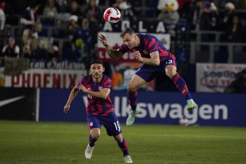 U.S. forward Jordan Morris, right, heads the ball next to midfielder Cristian Roldan during the second half.