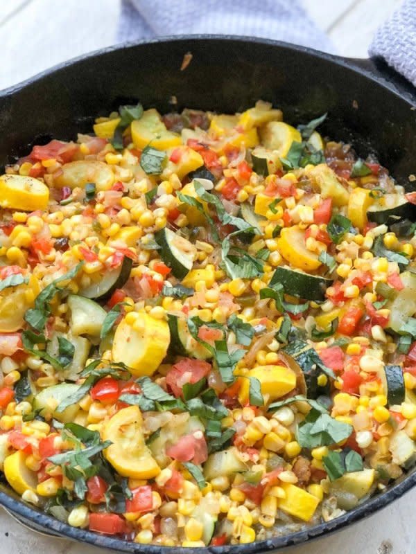 <p>Spoonful of Nola</p><p>This Southern side dish is chock full of my favorite veggies, golden yellow squash, deep green zucchini, corn cut fresh off the cob, and creole tomatoes. Sautéed in butter, onions and garlic, seasoned with your favorite Creole spices, then finished off in a hot oven, these veggies meld together in a rich, buttery, slightly sweet medley of texture and flavor.</p><p><strong>Get the recipe: <a href="https://spoonfulofnola.com/garden-vegetable-maque-choux/" rel="nofollow noopener" target="_blank" data-ylk="slk:Garden Vegetable Maque Choux;elm:context_link;itc:0;sec:content-canvas" class="link rapid-noclick-resp">Garden Vegetable Maque Choux</a></strong></p>