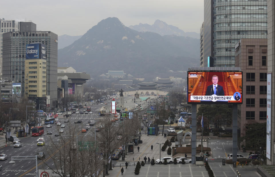 A TV screen shows the live broadcast of South Korean President Moon Jae-in's press conference in Seoul, South Korea, Thursday, Jan. 10, 2019. Moon has suggested he'll push for sanction exemptions to restart dormant economic cooperation projects with North Korea. The slug reads: "Basic pension expansion."(AP Photo/Ahn Young-joon)