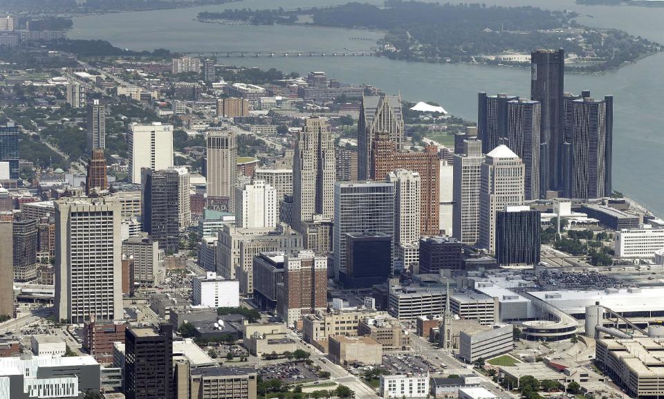 In this July 16, 2013 aerial file photo, the downtown of the city of Detroit is shown. Federal Judge Steven Rhodes approved bankrupt Detroit's plan to settle a bad multi-million dollar pension debt deal with two banks on Friday, April 11, 2014. Rhodes signed off on the agreement to pay $85 million to UBS and Bank of America. (AP Photo/Paul Sancya)