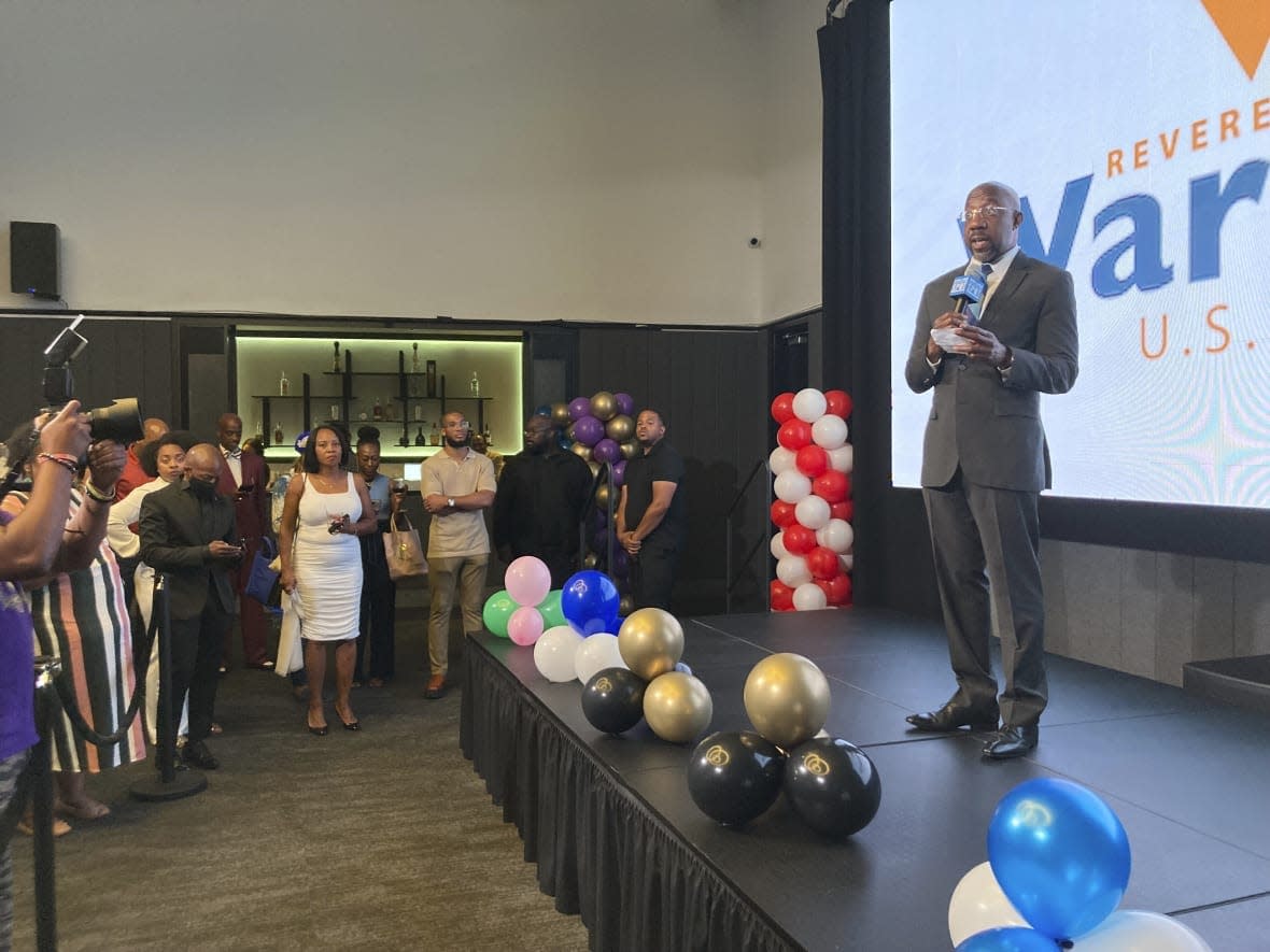 Georgia Sen. Raphael Warnock campaigns on Sept. 2, 2022, in Atlanta with other members of historically Black fraternities and sororities. (AP Photo/Bill Barrow)