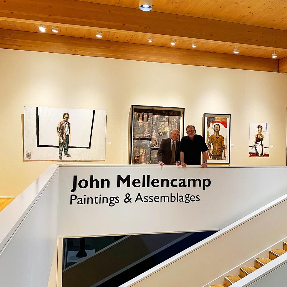 Randy Hoffman, John Mellencamp's agent, and Richard Mellencamp, John's father, at the Mansfield Art Center for Saturday night's preview of the new Mellencamp art exhibit.