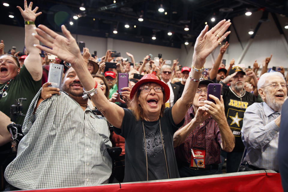 Supporters of President Donald Trump cheer as he arrives for a campaign rally, Thursday, Sept. 20, 2018, in Las Vegas. (AP Photo/Evan Vucci)