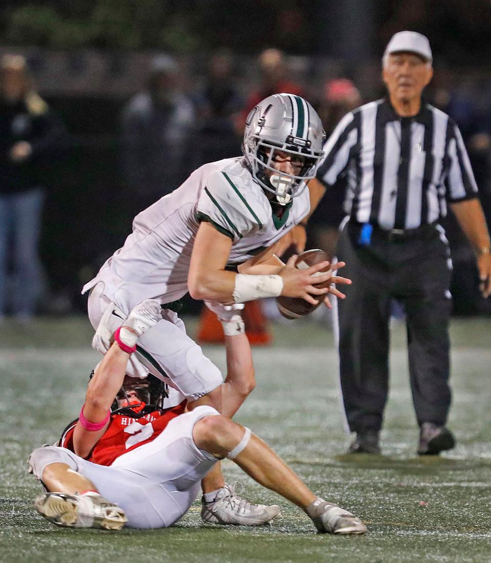 Dragons QB Trevor Jones tries to avoid a sack by Hingham's Pat Ryan.
The Hingham Harbormen hosted the Duxbury Dragons on the gridiron Friday, Oct. 27, 2023