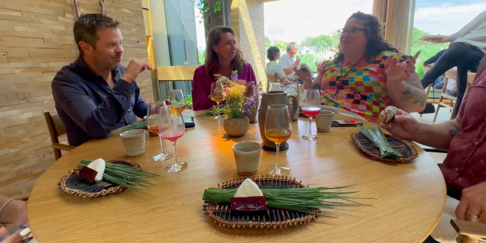 Guests at the table discuss the molded onigiri dish at Noma.