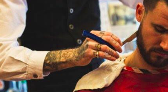 The period-style barber shop specialises in hot towel, straight razor shaves and the 'high and tight' haircut. Source: Facebook/Hawleywood's