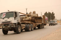 A tank belonging to the Libyan internationally recognised government forces arrives during the fighting with the Eastern forces in Ain Zara, in Tripoli, Libya April 21, 2019. REUTERS/Ahmed Jadallah