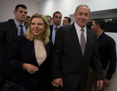 Israeli Prime Minister Benjamin Netanyahu (2ndR) and his wife Sara arrive at a courtroom to testify in a libel lawsuit they filed against an Israeli journalist, at the Magistrate Court in Tel Aviv, Israel March 14, 2017. REUTERS/Heidi Levine/Pool