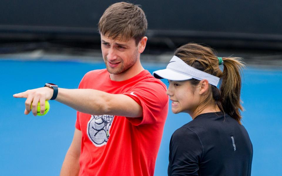 Emma Raducanu of Great Britain talks with coach Sebastian Sachs during a practice session ahead of the 2023 Australian Open at Melbourne Park on January 15, 2023 in Melbourne, Australia - Getty Images/Andy Cheung