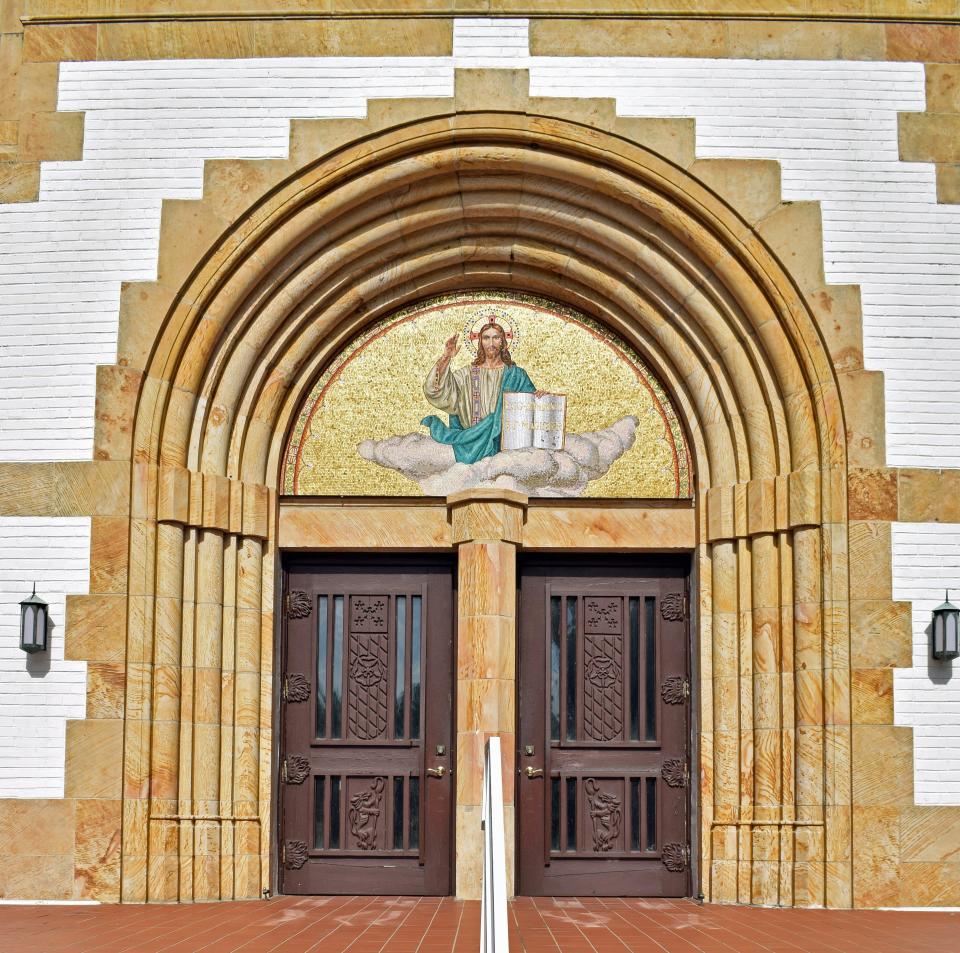 The church, which has not been altered on the exterior, has a basilica plan and Italian Romanesque architectural features, including mosaic and painted decorations.