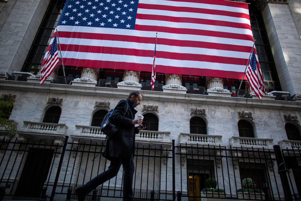 A man walks by the New York Stock Exchange (NYSE) on November 4, 2020 in New York.