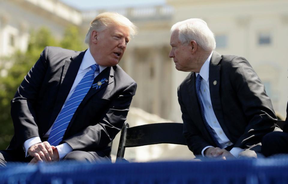 President Donald Trump speaks with Attorney General Jeff Sessions in happier times in May: Reuters