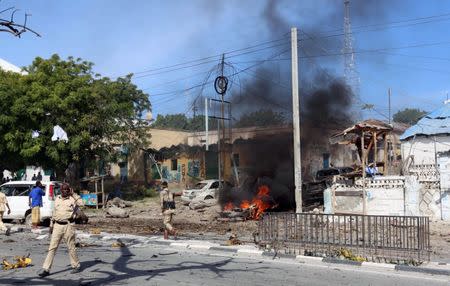 Somali policemen secure the scene of an explosion near Waberi police station station in Mogadishu, Somalia June 22, 2017. REUTERS/Feisal Omar