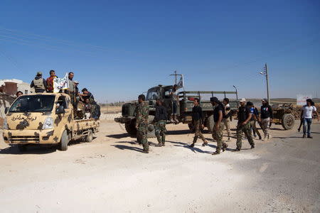 Free Syrian Army fighters gather before heading towards what they said an offensive against forces loyal to Syria's President Bashar al-Assaad in Deraa June 23, 2015. REUTERS/Alaa Al-Faqir