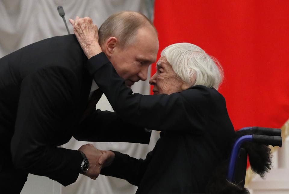 FILE - In this file photo taken on Monday, Dec. 18, 2017, Russian President Vladimir Putin, left, congratulates the Moscow Helsinki Group Chair and human rights activist Lyudmila Alexeyeva, during a ceremony to present the 2017 State Awards for Outstanding Achievements in Human Rights and and Charity Work at the Kremlin in Moscow, Russia. Alexeyeva, who was forced into exile by Soviet authorities after founding Russia's oldest human rights organization in 1976, passed away in a Moscow hospital Friday, Dec. 7, 2018 at age 91. (Yuri Kochetkov/Pool Photo via AP, File)