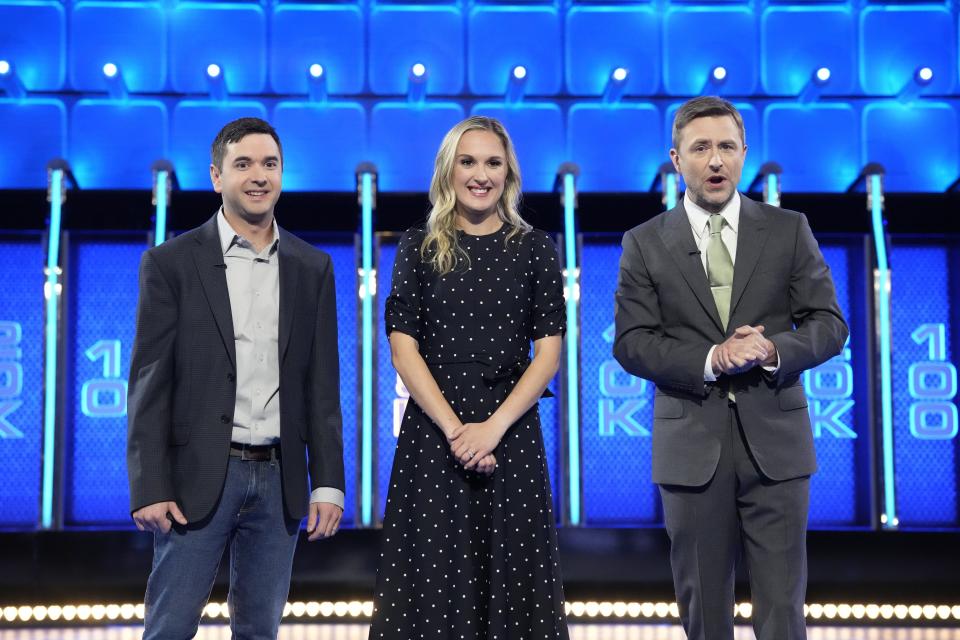 Nic and Christiana Trapani, owners of Door County Candle Co., appear with host Chris Hardwick, right, on the NBC game show "The Wall." The Trapanis are the contestants on the Season 5 premiere of the show airing April 11.