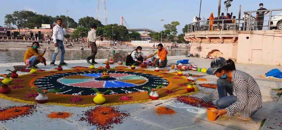 AYODHYA, INDIA - AUGUST 4: Rangoli being made as part of decorations on the eve of the Ram Temple foundation laying ceremony on August 4, 2020 in Ayodhya, India. Prime Minister Narendra Modi will on Wednesday attend a public function on laying of the foundation stone of 'Shree Ram Janmabhoomi Mandir' at Ayodhya. Ram Janmabhoomi Teerth Kshetra, the trust set up for the construction and management of Ram temple, has invited 175 eminent guests for the foundation stone-laying ceremony after personally discussing with BJP veterans L K Advani and Murli Manohar Joshi, lawyer K Parasaran and other dignitaries. (Photo by Deepak Gupta/Hindustan Times via Getty Images)