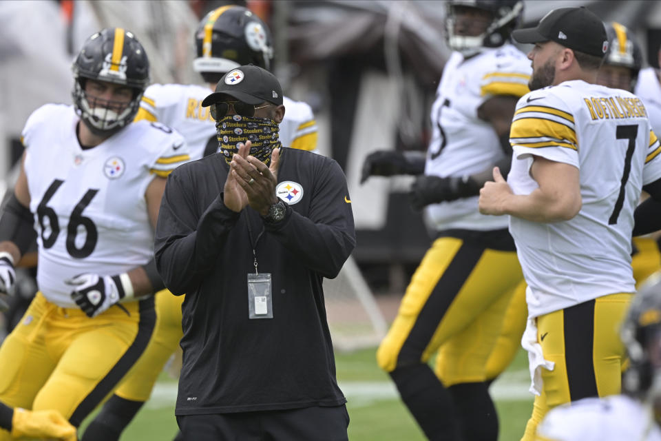 Pittsburgh Steelers head coach Mike Tomlin watches players warm up before an NFL football game against the Jacksonville Jaguars, Sunday, Nov. 22, 2020, in Jacksonville, Fla. (AP Photo/Phelan M. Ebenhack)