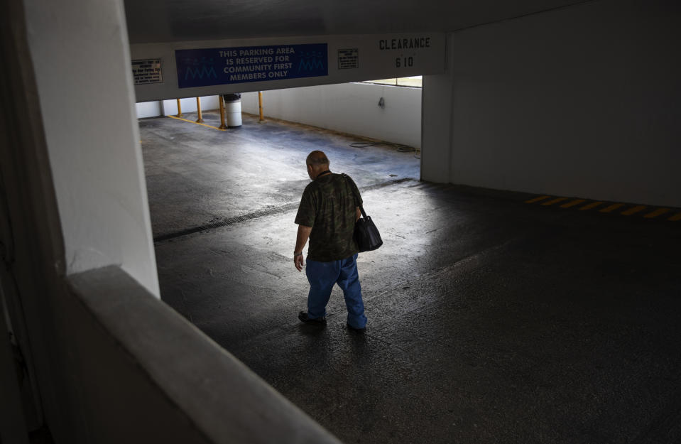 Former Boy Scout John Pangelinan returns to his car after visiting his lawyer in Hagatna, Guam, Wednesday, May 8, 2019. Pangelinan says he was about 12 years old when Father Louis Brouillard sexually abused him. "He said he wanted to measure my body," Pangelinan recounted. "Once it was over, I dressed up and put on clothes and in my mind I kept wondering what happened. Why did it occur? Because, you know, my father never did that to me, or my mom. And I started feeling really guilty that I did something wrong." Brouillard acknowledged abuse allegations before his death in 2018. (AP Photo/David Goldman)