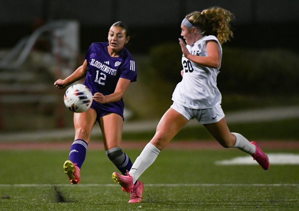 Bloomington South’s Gianna Stanton (12) kicks the ball upfield past Noblesville’s Kendall Kramer (20) during the IHSAA girls’ soccer state championship match at Michael Carroll Track & Soccer Stadium in Indianapolis, Ind. on Saturday, Oct. 28, 2023.