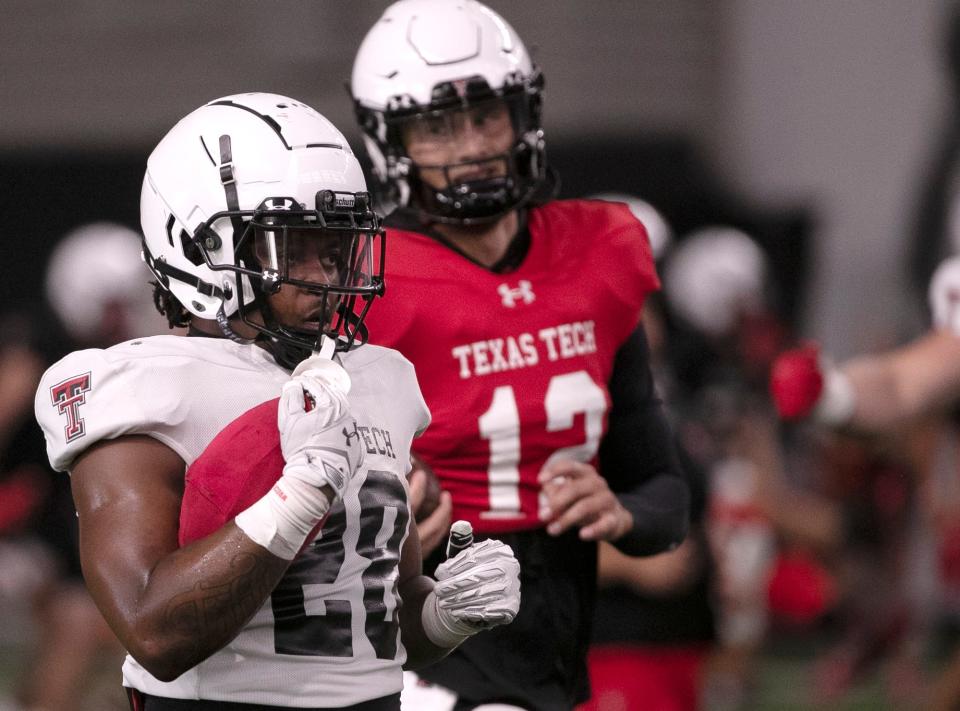 Texas Tech quarterback Tyler Shough (12) and running back Tahj Brooks (28) are key returnees on the Texas Tech offense. The Red Raiders open the season at 6:30 p.m. CDT Saturday at Wyoming.