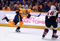 Feb 5, 2019; Nashville, TN, USA; Nashville Predators defenseman Roman Josi (59) attempts a shot during the first period against the Arizona Coyotes at Bridgestone Arena. Mandatory Credit: Christopher Hanewinckel-USA TODAY Sports