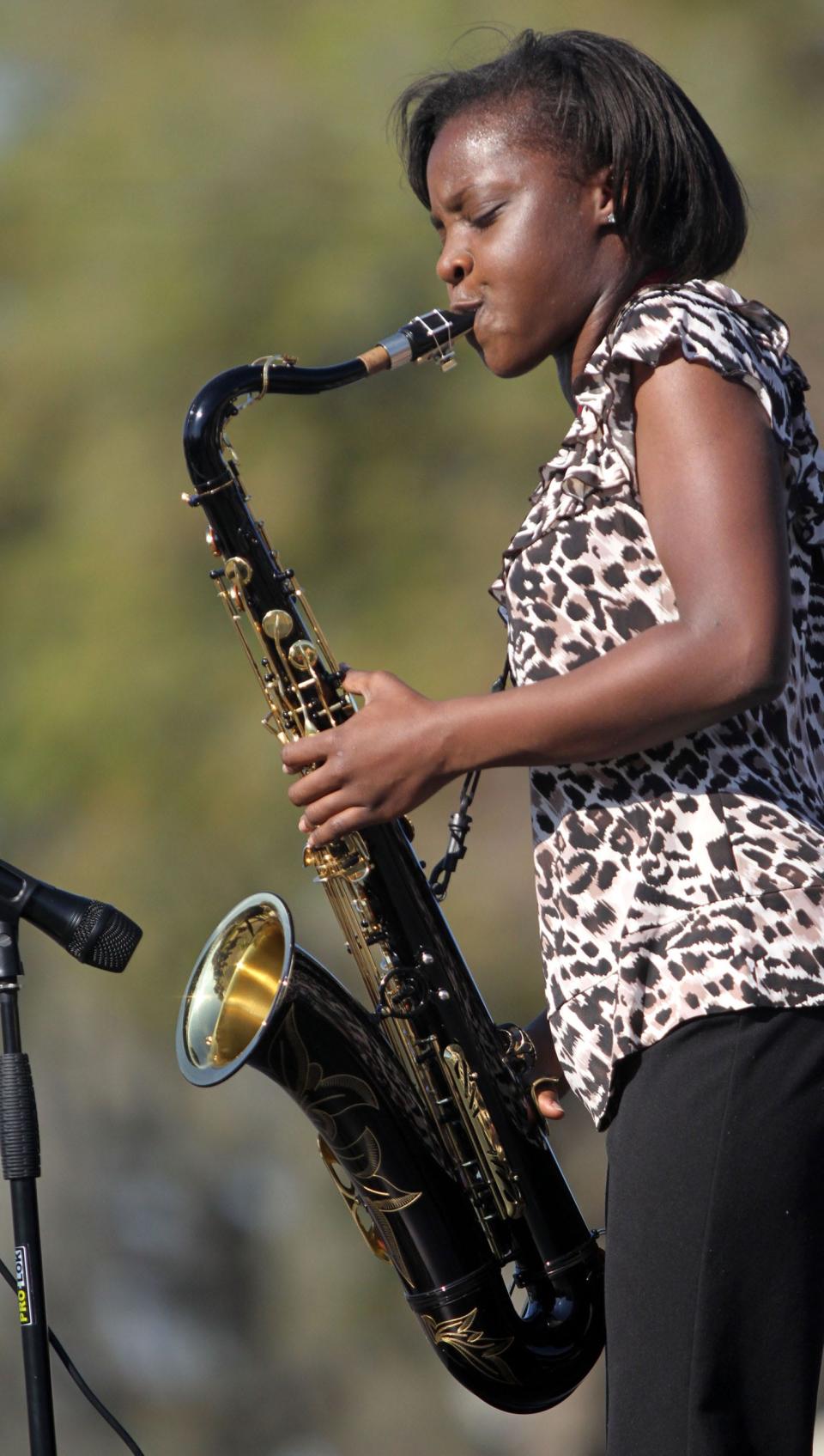 Jazmin Ghent is seen performing on tenor saxophone at the L.B. Brown Heritage Festival in Bartow in 2013.