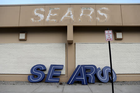 FILE PHOTO: A dismantled sign sits leaning outside a Sears department store one day after it closed as part of multiple store closures by Sears Holdings Corp in the United States in Nanuet, New York, U.S., January 7, 2019. REUTERS/Mike Segar