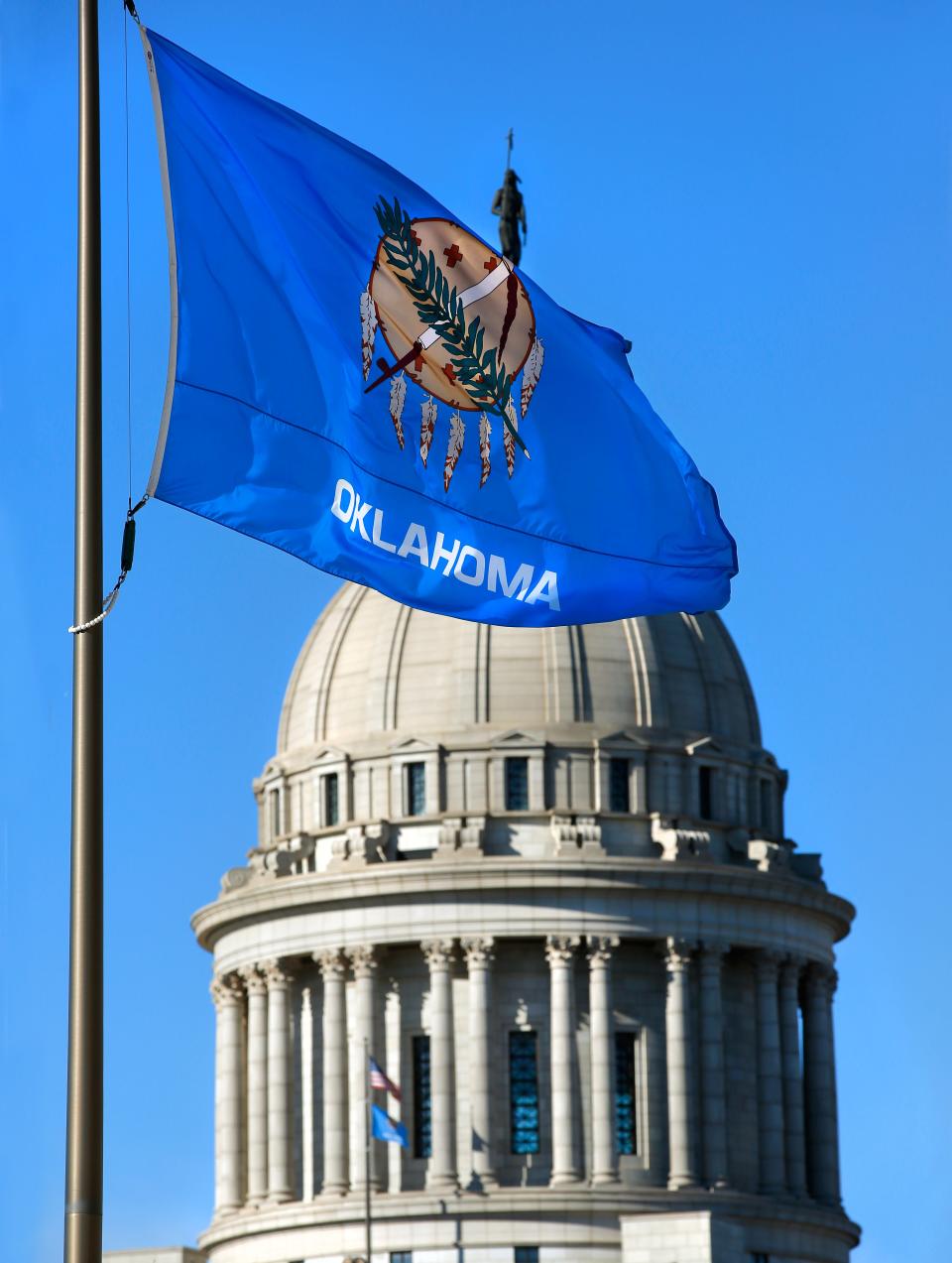 Oklahoma's state flag is seen waving in front of the Oklahoma Capitol in Oklahoma City.