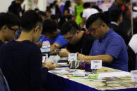 Gamers playing at the designated Card Game area. (Photo: Sharlene Sankaran/Yahoo Singapore)