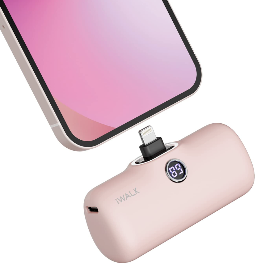 Mini Portable Charger in light pink connecting to pink iphone (Photo via Amazon)