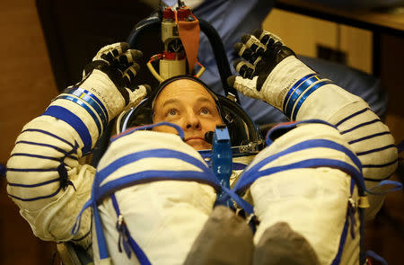 The International Space Station (ISS) crew member Scott Tingle of the U.S. looks on during his space suit check shortly before his launch at the Baikonur Cosmodrome, Kazakhstan December 17, 2017. REUTERS/Shamil Zhumatov