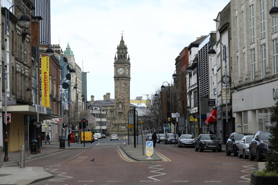 Deserted streets due to the coronavirus restrictions in Belfast city centre, Northern Ireland, Monday, March, 30, 2020. The new coronavirus causes mild or moderate symptoms for most people, but for some, especially older adults and people with existing health problems, it can cause more severe illness of death. (AP Photo/Peter Morrison)