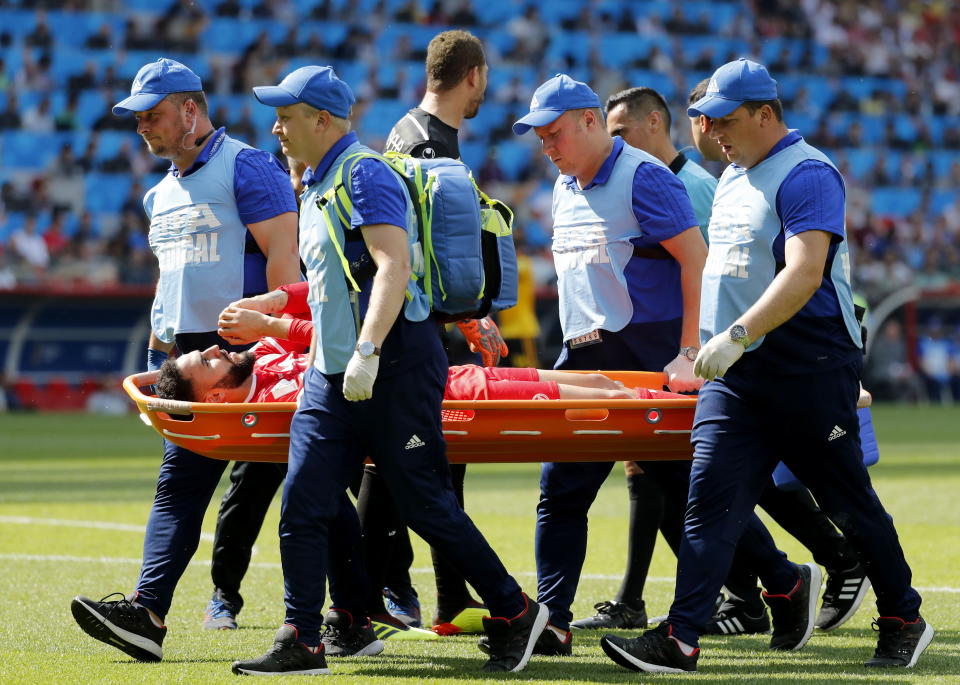 <p>Dylan Bronn of Tunisia, scorer of a goal for his side, is brought off the pitch on a stretcher. </p>