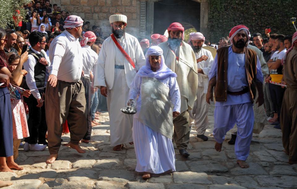 Iraqi Yazidis take part in a religious ceremony at the Temple of Lalish, in a valley near the Kurdish city of Dohuk, in 2019. (Safin Hamed/AFP via Getty Images)