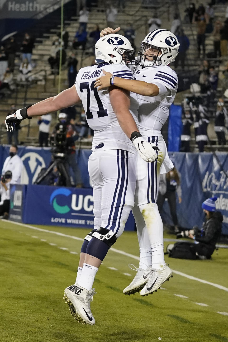BYU quarterback Zach Wilson, right, celebrates with offensive lineman Blake Freeland after scoring against Western Kentucky during the first half of an NCAA college football game Saturday, Oct. 31, 2020, in Provo, Utah. (AP Photo/Rick Bowmer, Pool)