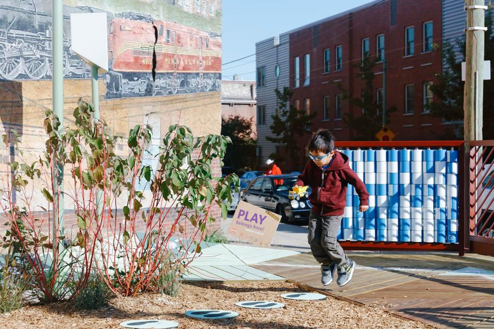 A child plays at the Urban Thinkscape installation in west Philadelphia’s Belmont neighborhood (Sahar Coston-Hardy Photography/Playful Learning Landscapes)