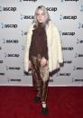 <p>One of Eilish's first red carpet appearances saw the singer subvert the idea of granny chic with grey hair, brown jacket and a teddy-bear coat, plus a flash of silky leopard print. A style icon in the making. </p>