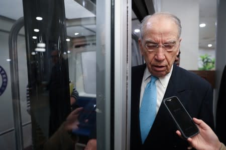 U.S. Senator Grassley speaks to reporters on his way from the Senate floor after a vote at the U.S. Capitol in Washington