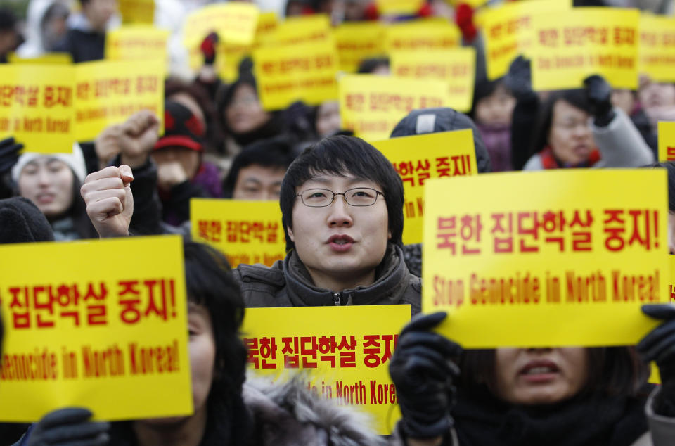 In this photo taken on Dec. 9, 2011, South Korean activists shout slogans during a rally denouncing North Korea's alleged genocide and crimes against humanity in Seoul, South Korea. After the war, more than 500 South Koreans were abducted by North Korean agents and have not returned, according to Seoul's Unification Ministry. About 90 percent of them were fishermen. And more than 21,000 North Koreans have defected to the South, Seoul says. (AP Photo/Lee Jin-man)