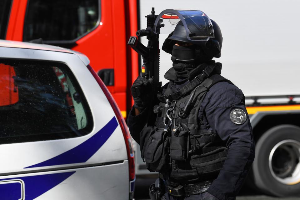 A French police intervention unit (GSO) officer secures the area after several people were injured near the former offices of the French satirical magazine Charlie Hebdo following an attack by a man wielding a knife in the capital Paris on September 25, 2020. - Four people were injured, two seriously, in a knife attack in Paris on September 25, 2020, near the former offices of French satirical magazine Charlie Hebdo, a source close to the investigation told AFP. Two of the victims were in a critical condition, the Paris police department said, adding two suspects were on the run. The stabbing came as a trial was underway in the capital for alleged accomplices of the authors of the January 2015 attack on the Charlie Hebdo weekly that claimed 12 lives. (Photo by Alain JOCARD / AFP) (Photo by ALAIN JOCARD/AFP via Getty Images)