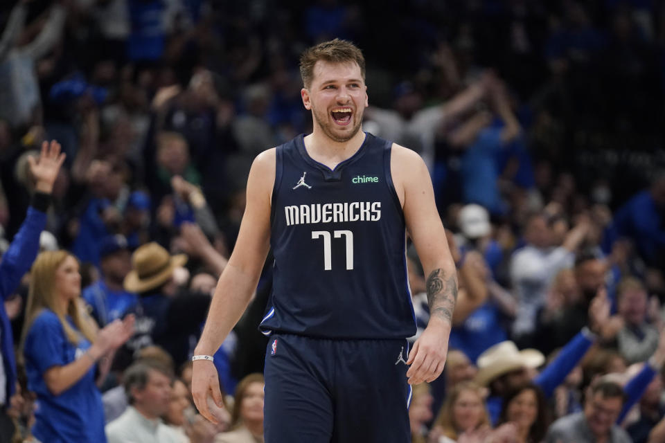 Dallas Mavericks guard Luka Doncic (77) celebrates after scoring against the Utah Jazz during the second half of Game 5 of an NBA basketball first-round playoff series, Monday, April 25, 2022, in Dallas. (AP Photo/Tony Gutierrez)
